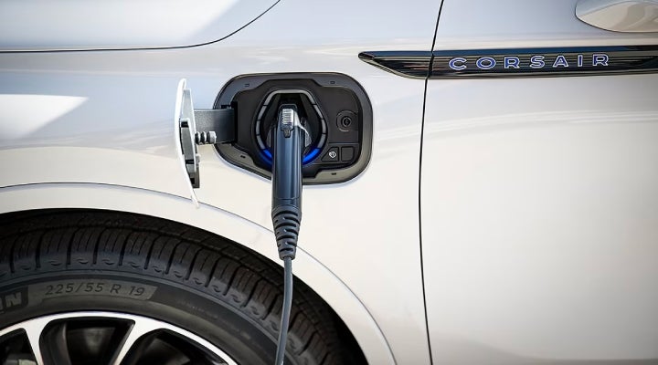 An electric charger is shown plugged into the charging port of a Lincoln Corsair® Grand Touring
model. | Caruso Lincoln in Long Beach CA